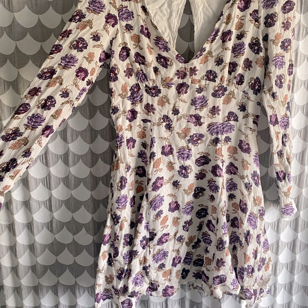 FREE PEOPLE long-sleeved dress with back cut out.